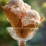 peach ice cream in waffle cone
