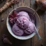 creamy purple taro ice cream in a rustic bowl