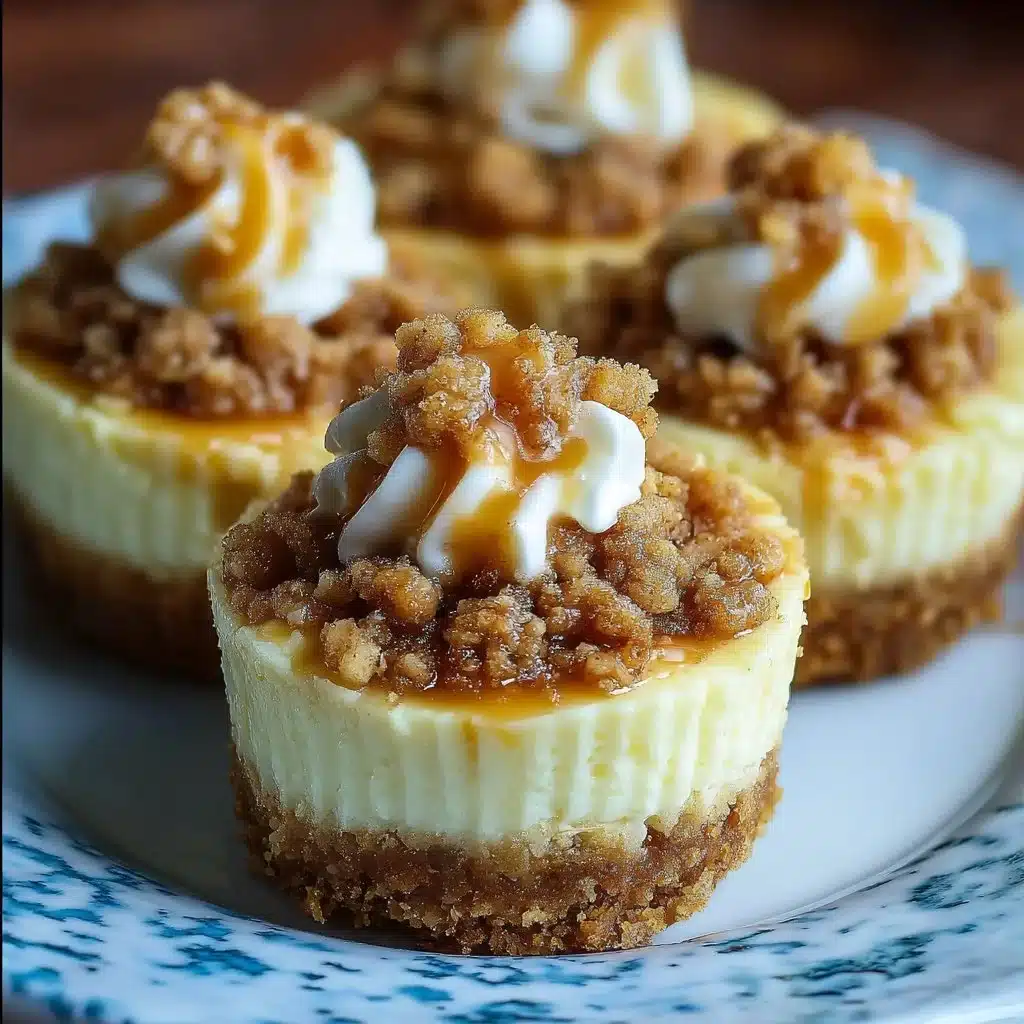 Delicious Apple Crisp Mini Cheesecakes topped with crumbly apple crisp.