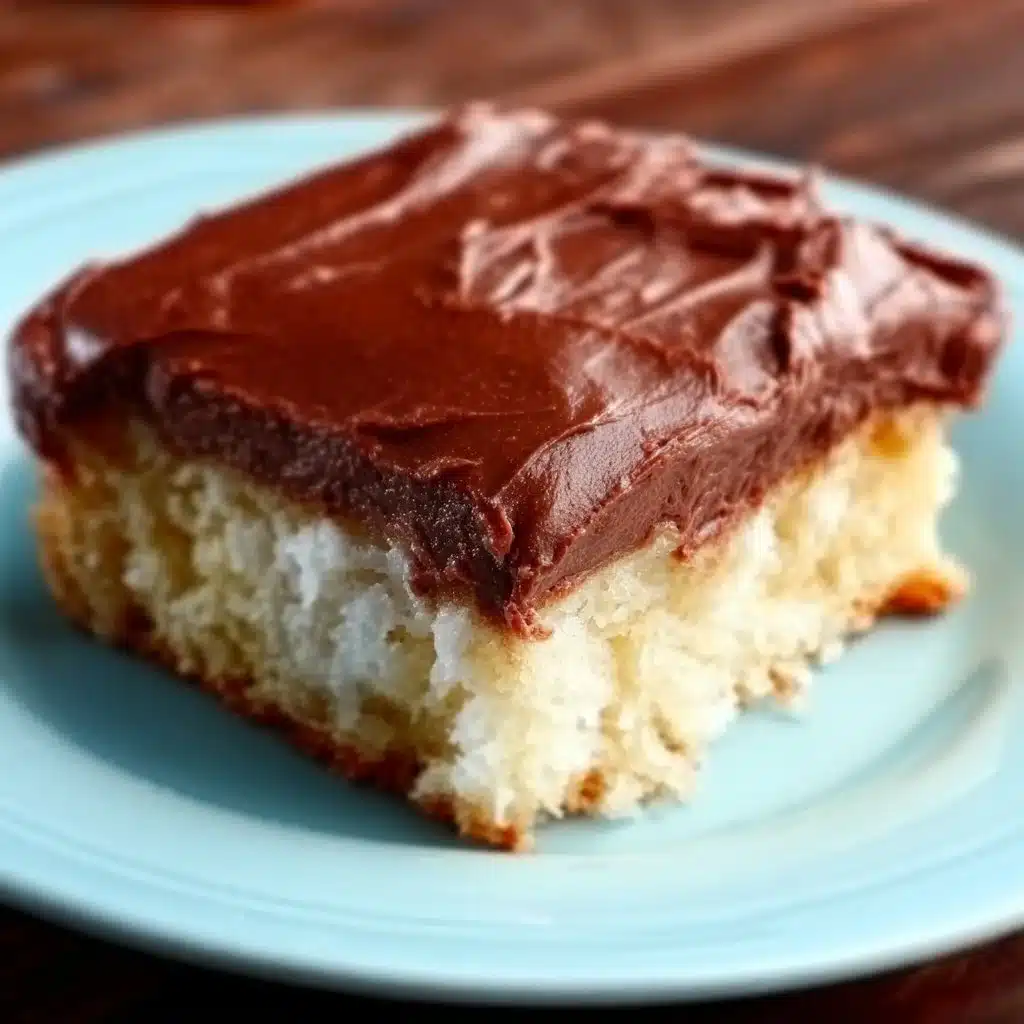 White Texas Sheet Cake with Chocolate Fudge Frosting on a platter.