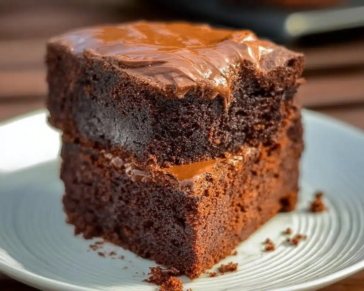 Flourless Sweet Potato Chocolate Cake topped with chocolate glaze and fresh berries