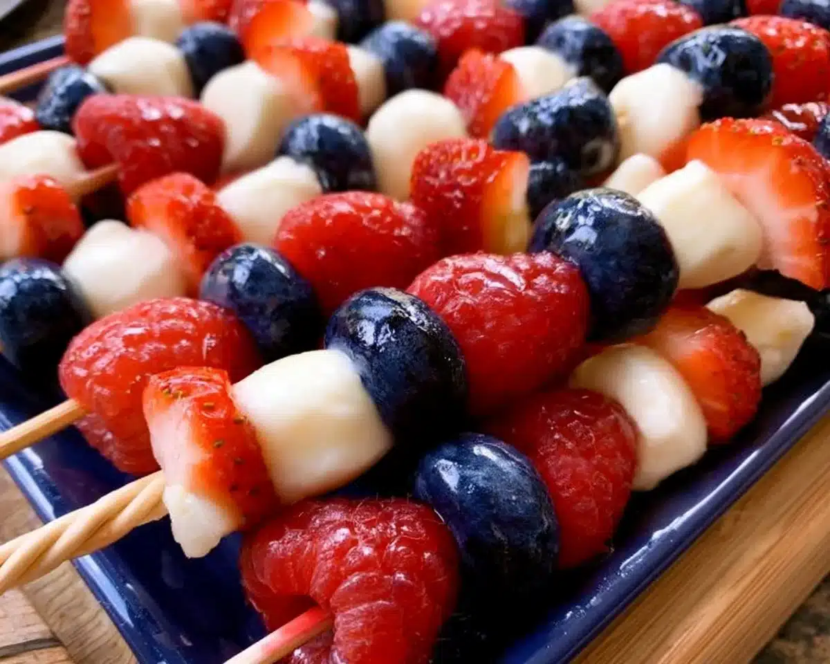 Red, White and Blue Fruit Kabobs made with fresh strawberries, blueberries, and marshmallows.