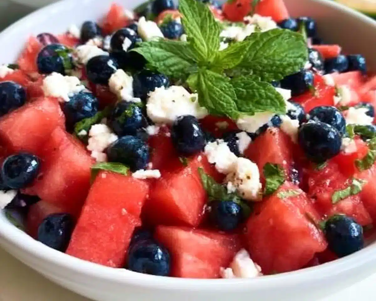 Watermelon blueberry feta salad with fresh ingredients in a bowl